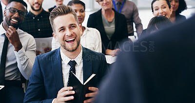 Buy stock photo Man, happy and laughing in crowd, conference and attention for announcement with group. Business people, speaker and audience with diversity, joke and notebook for convention at insurance agency