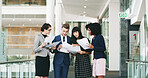Office, colleagues and discussion with paperwork, meeting and people with evidence for case and paralegal. Smile, group and employees with documents in law firm, happy or legal assistant with records