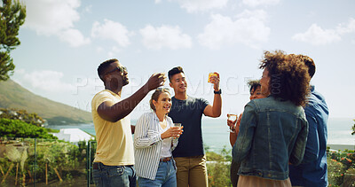 Buy stock photo Balcony, drinking and toast with friends outdoor together for celebration, holiday or vacation. Alcohol, bonding or smile with man and woman group at mountain hotel for accommodation or hospitality