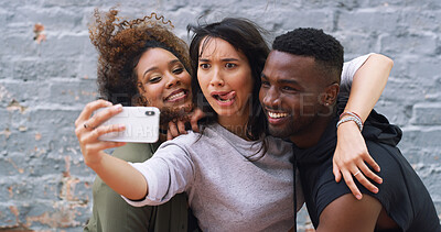 Buy stock photo Selfie, funny and group of friends by wall in city for memory, social media or profile picture on holiday. Happy, goofy and young people with photography for reunion content creation vlog in town.
