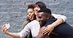 Selfie, silly and group of friends by wall in city for memory, social media or profile picture on holiday. Happy, goofy and young people with photography picture for content creation vlog in town.