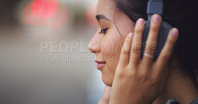 Buy stock photo Headphones, peace and woman in city with music for anxiety release in morning on travel journey. Calm, audio tech and female student listening to online zen playlist, podcast or radio in urban town.