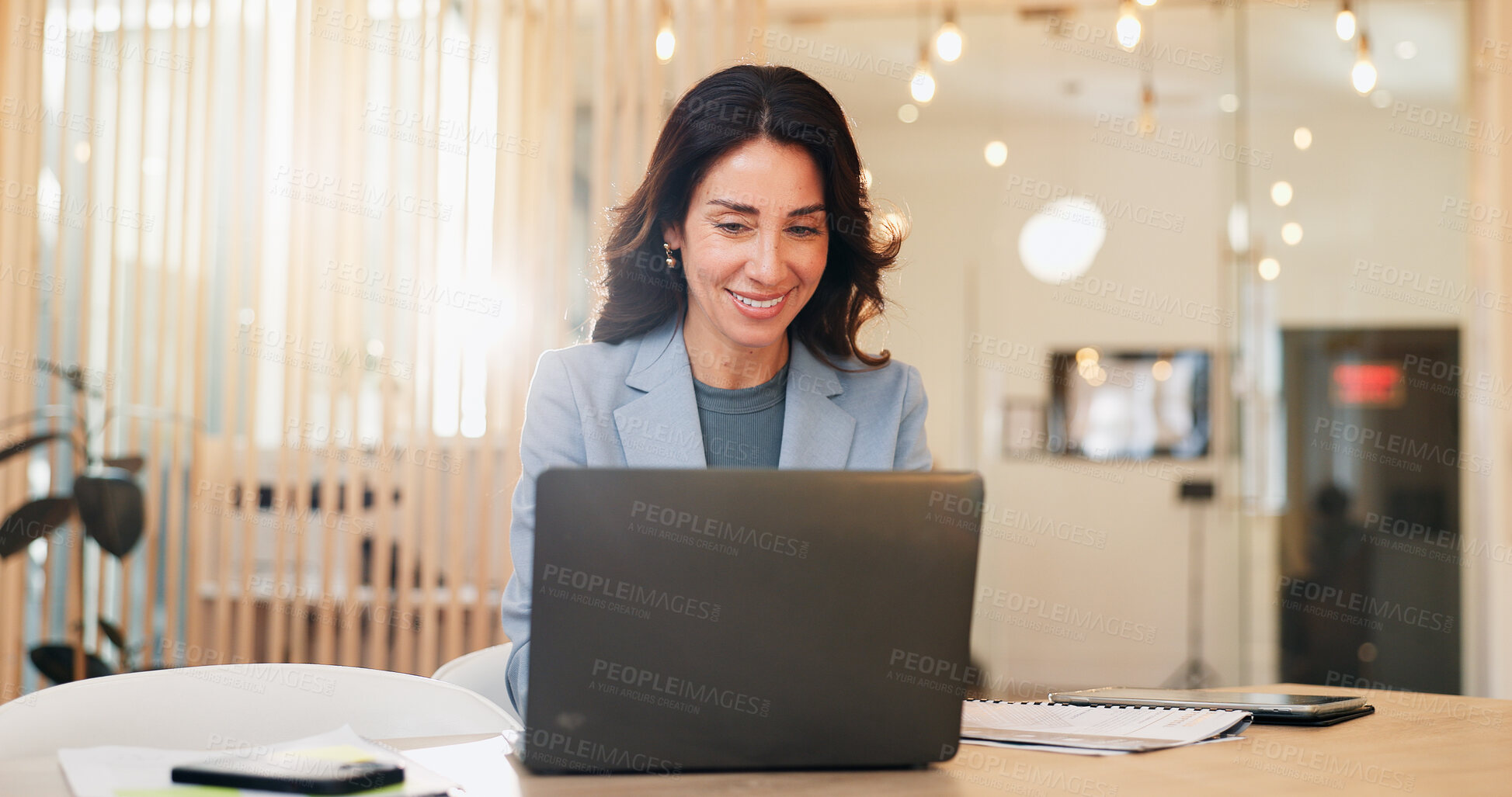 Buy stock photo Laptop, smile and typing with business woman at desk in coworking space for online accounting. Computer, finance and review with happy mature accountant in office for administration or planning