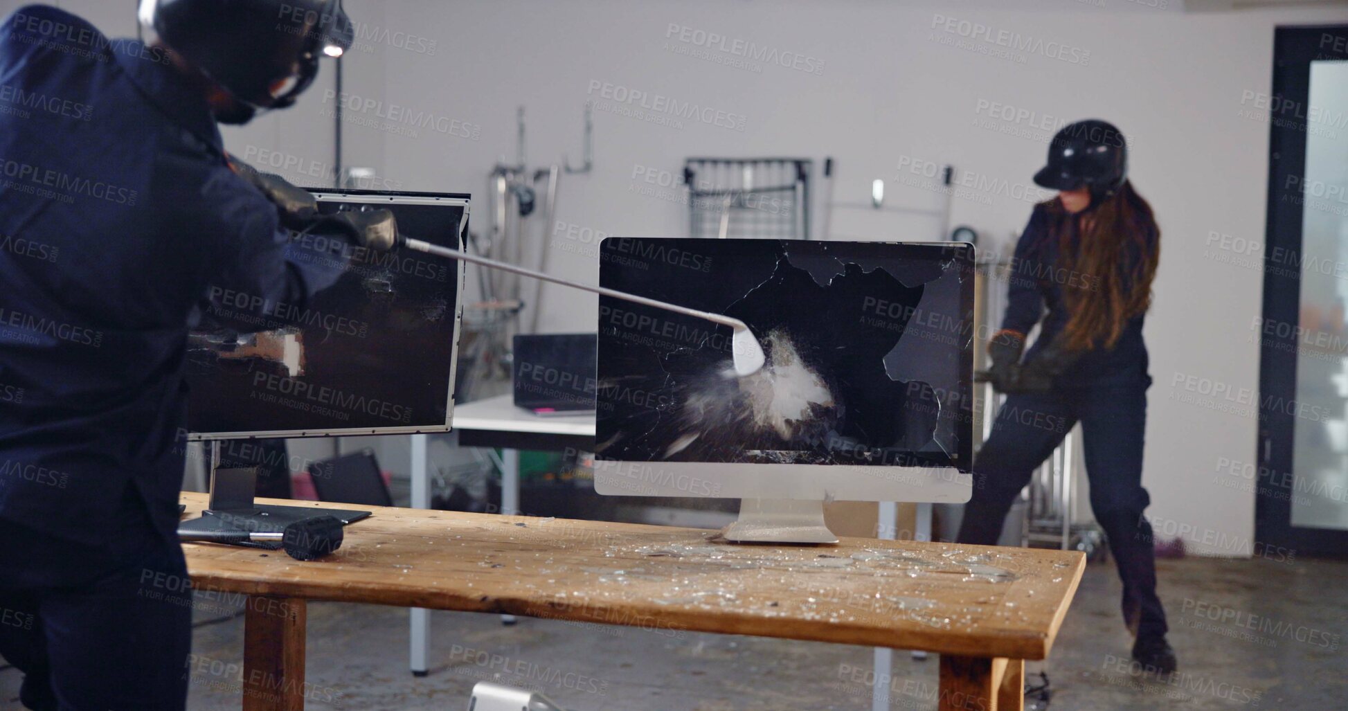 Buy stock photo Screen, weapon and friends in rage room for frustrated, anger management and stress relief. Golf club, safety gear and violence with people in smash center for demolition break and cathartic therapy