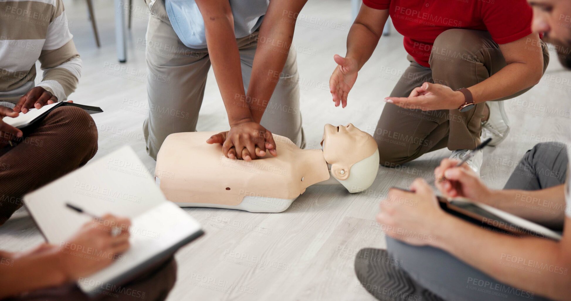 Buy stock photo People, mannequin or hands in office for CPR, first aid workshop or chest compression lesson. Colleagues, emergency practice or dummy in agency for life saving procedure, notes or employee engagement