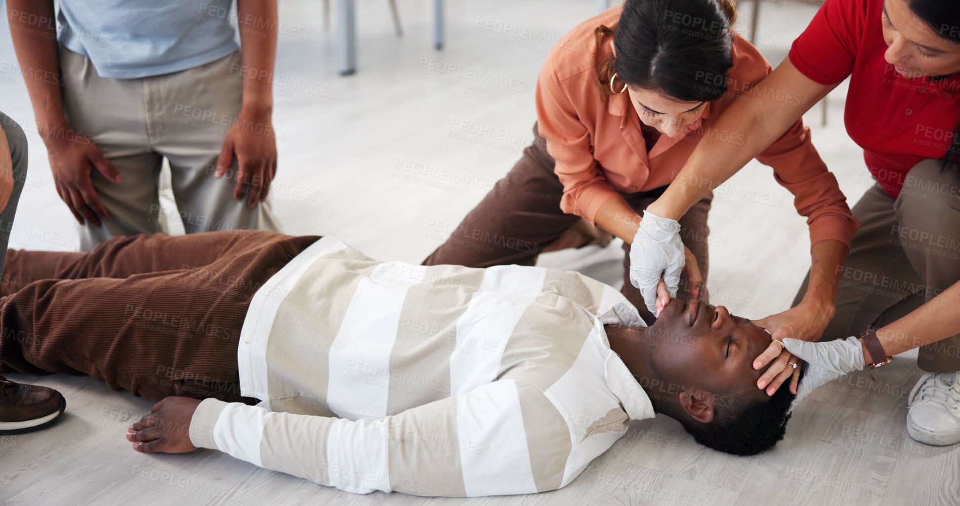 Buy stock photo People, demonstration and class for first aid, breathing or titling for prevention of choking or learning. Airway management, teacher and technique to help with cardiac arrest, hands or CPR for group