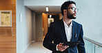 Tablet, thinking and walking with business man in corridor of office for appointment or schedule. Glasses, idea and vision with corporate employee in workplace for agenda, planning or research