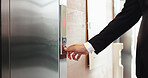 Hands, office and person press elevator, transport technology and arrow to request down floor. Business, call lift and push button for travel, work trip and level choice in corporate hotel lobby