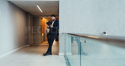 Buy stock photo Break, corridor and tablet with business man in office for corporate research or online planning. Internet, leaning and space with professional employee reading information in workplace for update