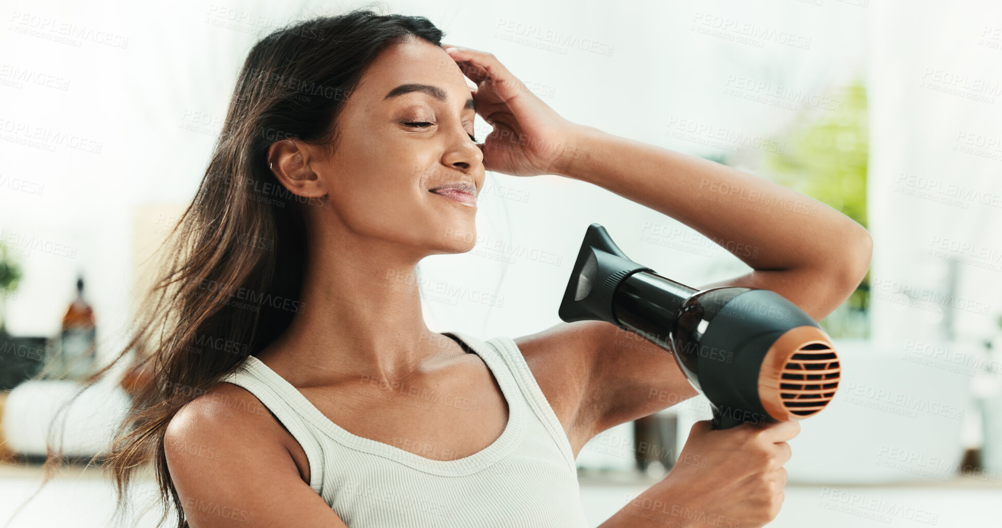 Buy stock photo Home, woman and hair care with blow dryer to frizz control, heat treatment and smile for daily routine. Bathroom, female person and wind with electric appliance for style, smooth texture and growth