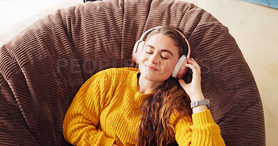Buy stock photo Relax, happy and woman with headphones, cozy and comfortable on couch in home, student and morning. Living room, resting and streaming of music on sofa, calm and break in new apartment for university