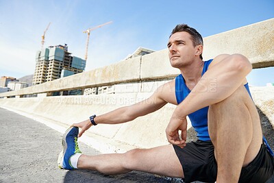 Buy stock photo Man, stretching legs and runner in city, warm up for cardio workout and fitness outdoor. Athlete, sports and running in New York with health, wellness and ready for race or marathon on urban bridge