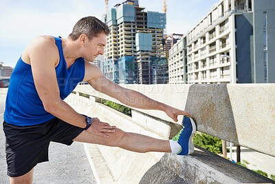 Buy stock photo Man, stretching legs and runner outdoor, warm up for cardio workout and fitness in city. Athlete, sports and running in New York with health, wellness and ready for race or marathon on urban bridge