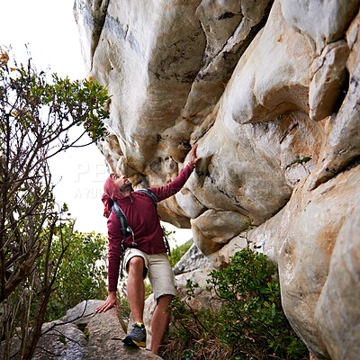 Buy stock photo Man, mountain climbing and fitness for travel outdoor, freedom and journey with adventure, focus and strong. Determination, concentration and trekking with challenge, peak and rocks on rough terrain