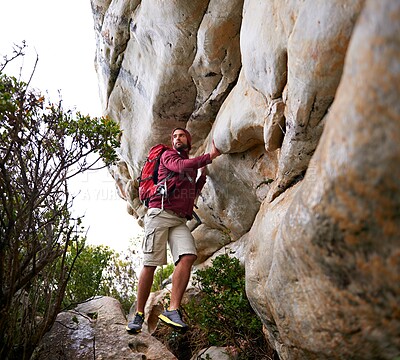 Buy stock photo Man, mountain climbing and exercise for travel outdoor, freedom and journey with adventure, focus and strong. Determination, concentration and trekking with challenge, peak and rocks on rough terrain