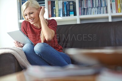 Buy stock photo Woman, home and tablet on sofa with video call or online shopping with a smile. Living room, happy and internet sale with digital, tech and website in a lounge with social media and download