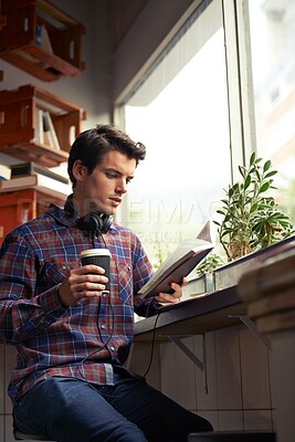 Buy stock photo Education, student or man reading book at cafe for literature, learning or history on campus. Break, drink or person studying english novel for journalism at coffee shop for tea beverage or research