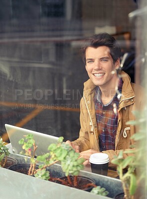 Buy stock photo Man, portrait and laptop with smile in coffee shop for remote work, typing or research in morning. Person, journalist or writer with computer, happy or editing process by window for article in cafe