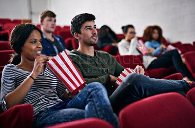 Buy stock photo Movie, date and couple in cinema at night with popcorn to relax and watch in theatre with happiness. Film, experience and people in audience enjoy funny comedy, drama performance or eating snack food