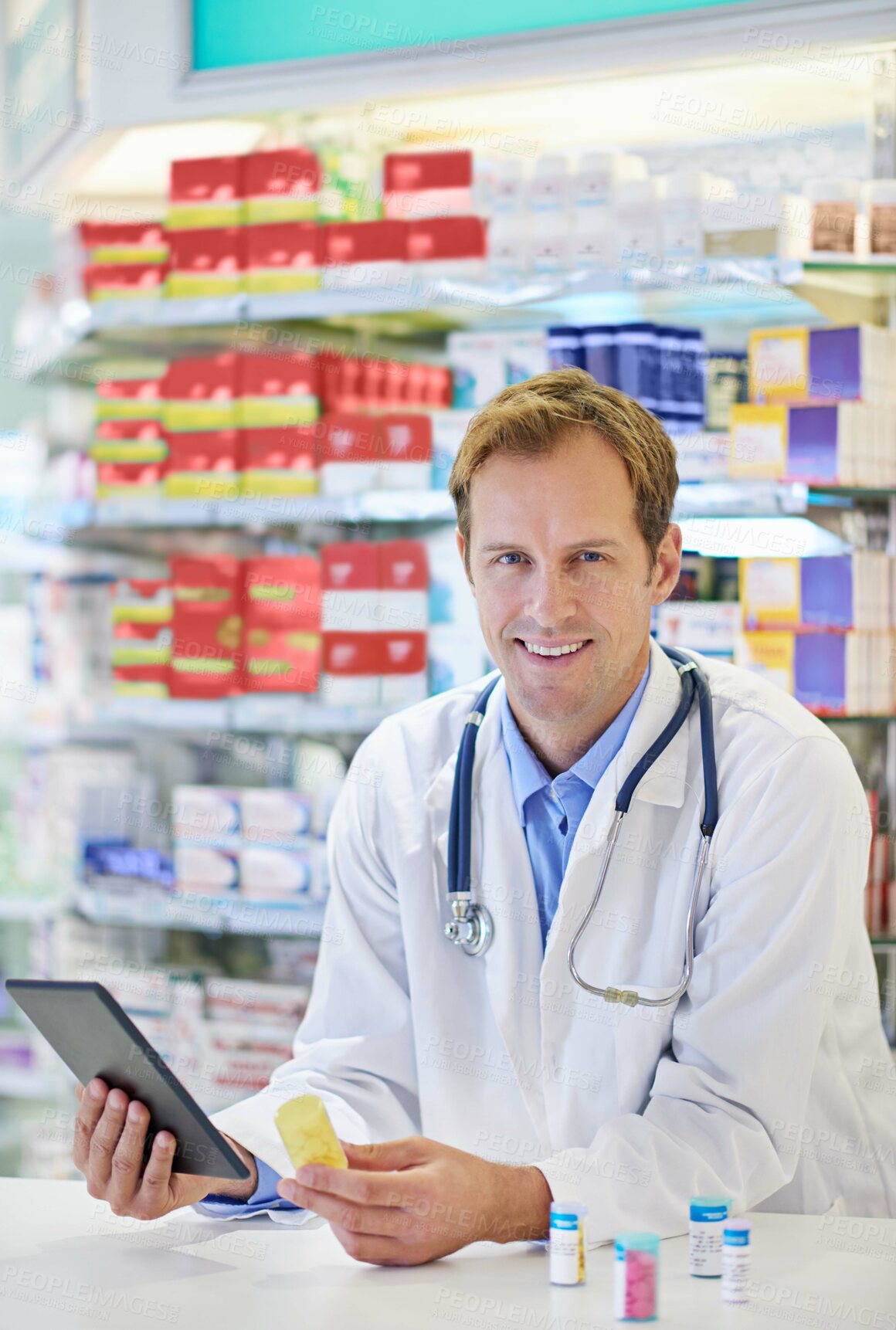 Buy stock photo Pharmacist, tablet and pharmaceuticals for telehealth, portrait or medicine in drugstore, chemist or services. Male person, doctor and pills in clinic for stock, inventory for information or advice