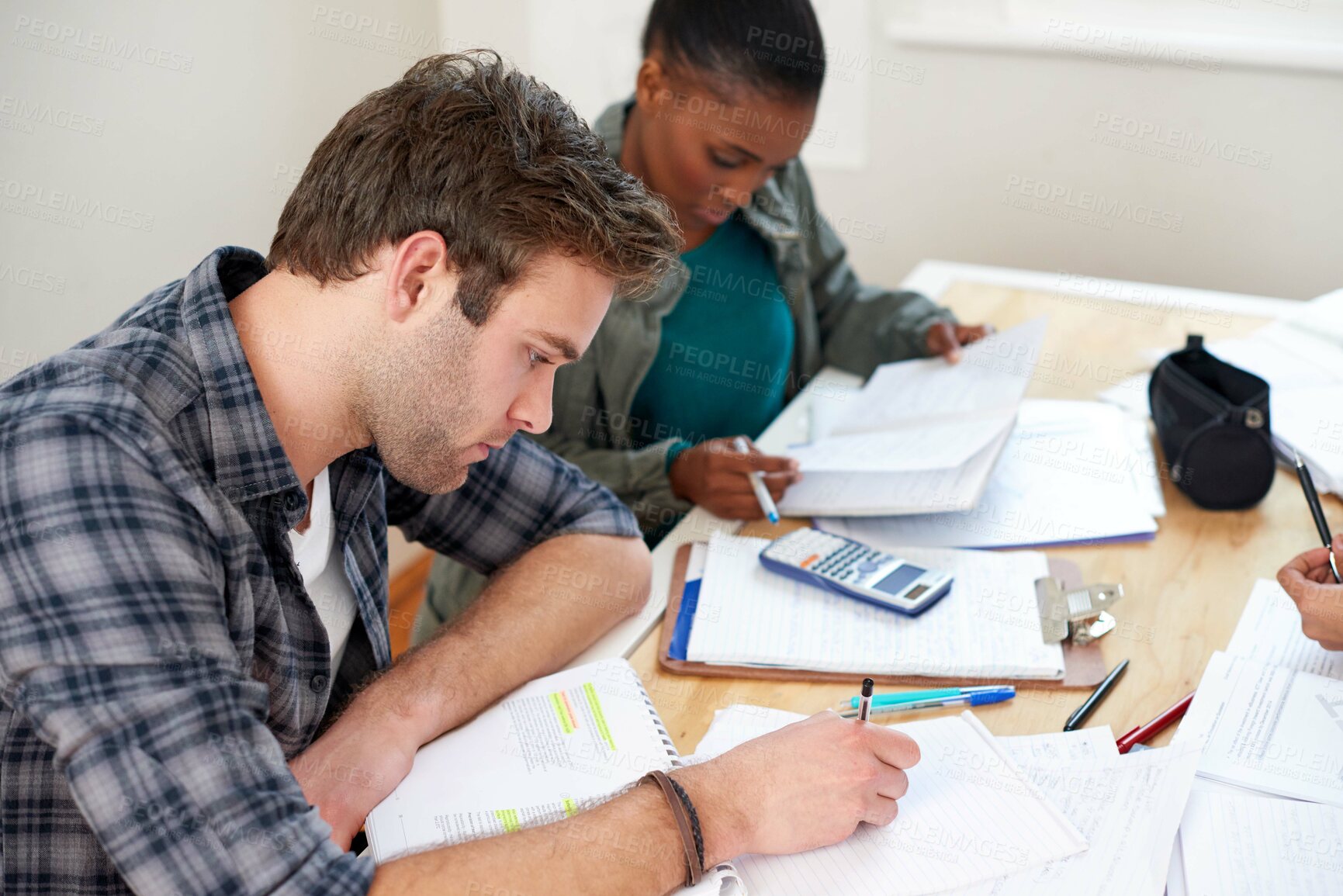 Buy stock photo Friends, students and writing notes in university for learning, knowledge or test together. College, team and people on book for information, education or math exam preparation project in classroom