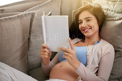 Buy stock photo Pregnant, woman and book for babies, couch and home in apartment, planning for child in lounge. House, mother and female person with smile, relax and reading, rest and love for life in living room