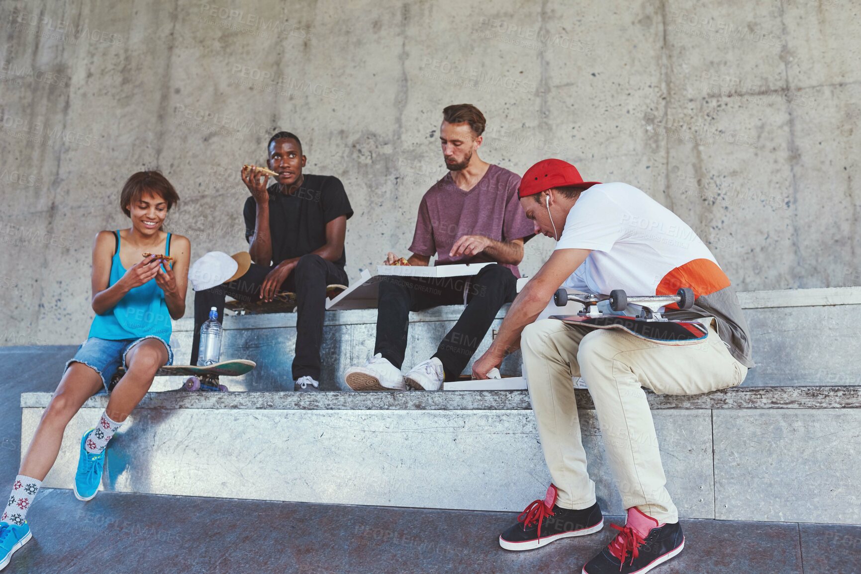 Buy stock photo Skater, people and eating of food outdoor for pizza lunch, fitness break and bonding with takeaway. Friends, nutrition meal and skateboard for sports recovery, hungry and exercise performance in city