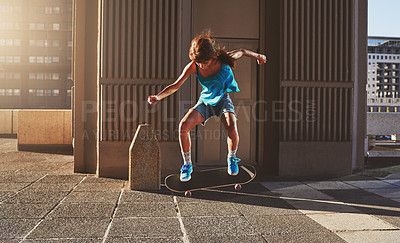 Buy stock photo Skateboard, city and girl with flip in air for jump stunt, practice and energy in New York. Woman, skater and female person with ollie trick on concrete for outdoor talent, skill competition or hobby