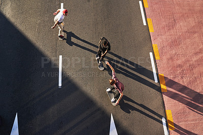Buy stock photo Group, skating and friends with skateboard, sport and active for race in city, fitness or high angle. Outdoor, above and travel for competition on street, skateboarding or practice for game or people