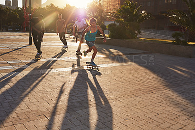 Buy stock photo Friends, skateboard hobby and people in street, city or outdoors for fun practice. Exercise, fitness and group sports with training and skaters bonding together on urban road for downtown workout