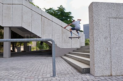 Buy stock photo Man, skateboarder and jump stairs in urban city, ollie and back for skating challenge on steps. Fitness, outdoor hobby and board for practice in downtown, performance trick and holiday for stunt