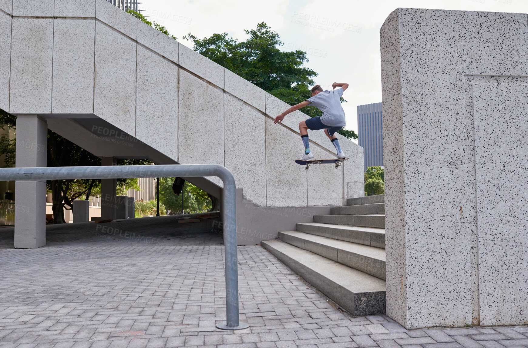 Buy stock photo Man, skateboarder and jump stairs in urban city, ollie and back for skating challenge on steps. Fitness, outdoor hobby and board for practice in downtown, performance trick and holiday for stunt