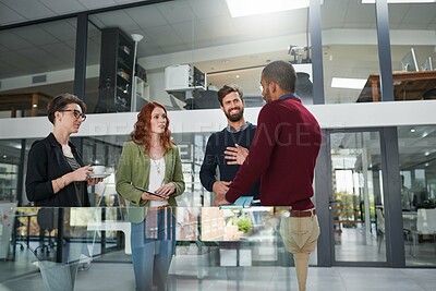 Buy stock photo Cropped shot of a group of young creatives having a meeting in a modern office