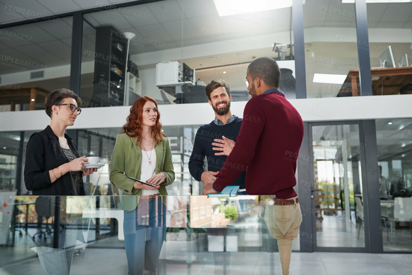 Buy stock photo Cropped shot of a group of young creatives having a meeting in a modern office