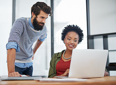 Buy stock photo Creative people, laptop and team with discussion for design, planning or meeting at office. Man and woman working on computer for collaboration, social media or communication in startup at workplace