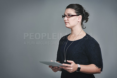 Buy stock photo Business woman, tablet and thinking in studio, decision and notification with mock up space by background. Person, digital touchscreen and choice for deal, app and perspective for career with project