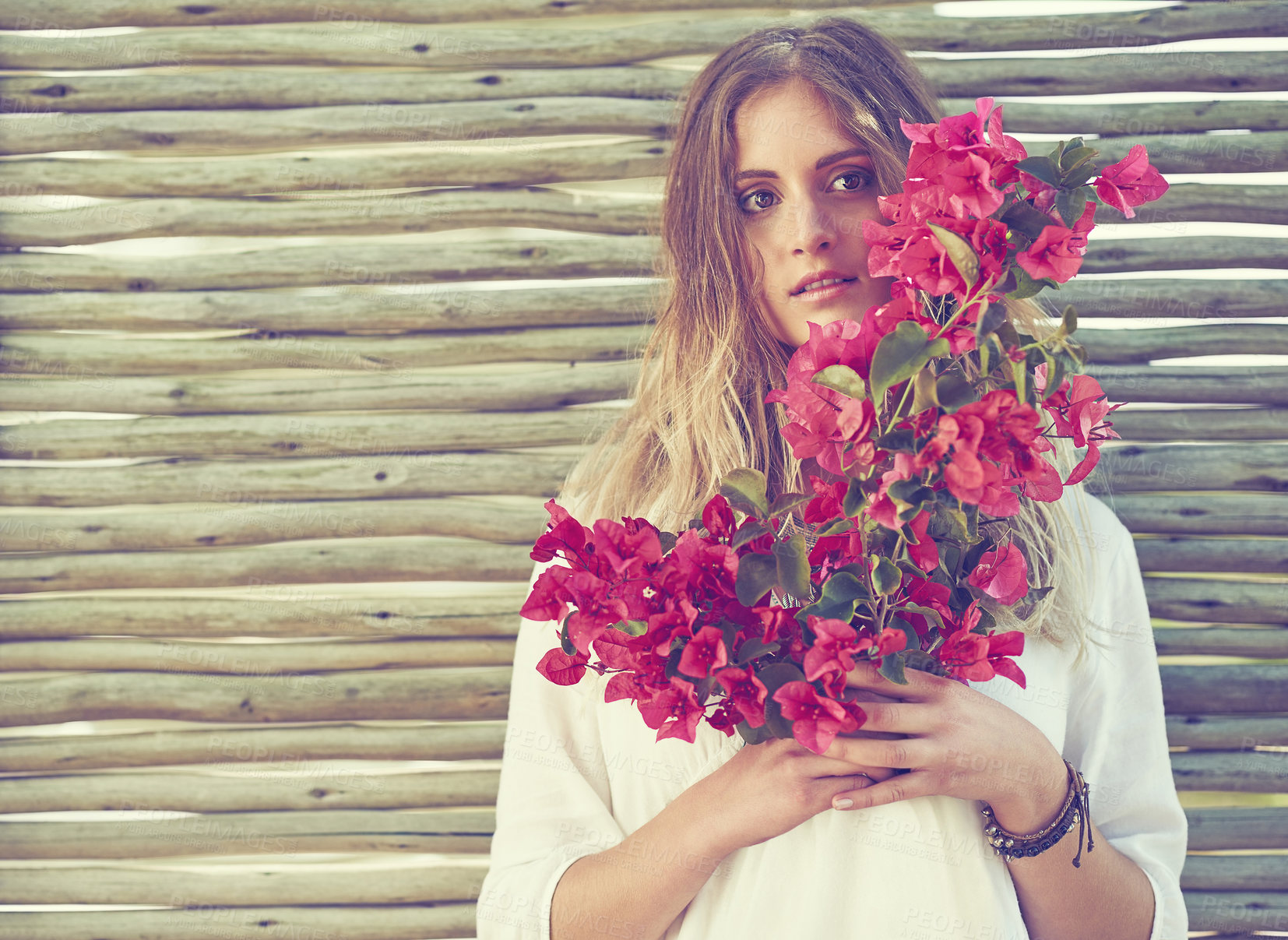 Buy stock photo Bohemian, fashion and portrait of woman with flower bouquet for sustainable, casual and hipster outfit. Boho, blossom and female person with pink bogainvillea floral plants with eco friendly style.