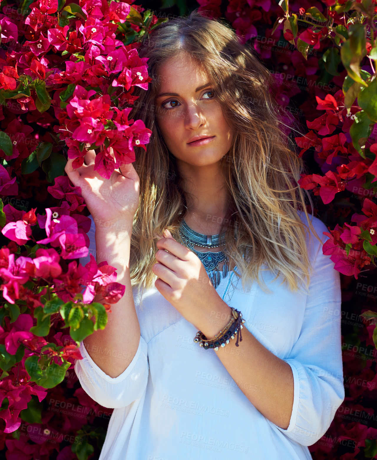Buy stock photo Woman, thinking and flowers bush for fashion with aesthetic, sustainable beauty and casual clothes. Female person, jewellery idea and pink plants for summer season, stylish outfit and blooming garden