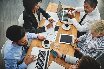 Buy stock photo Shot of a group of businesspeople having a meeting in an office