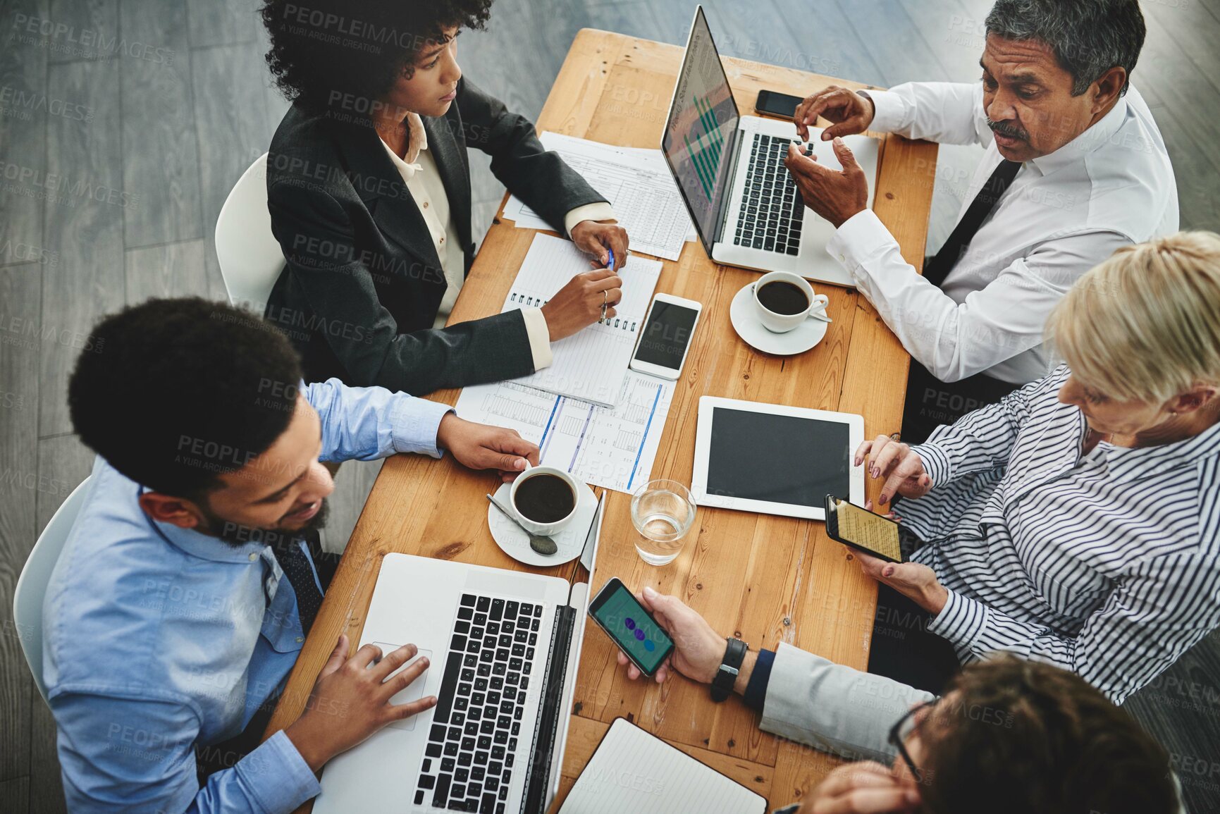 Buy stock photo Shot of a group of businesspeople having a meeting in an office