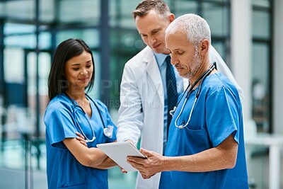 Buy stock photo Doctor, nurse and team with tablet for research or telehealth communication or online, consultation or teamwork. Men, woman and medical app for client conversation or internet, website or insurance