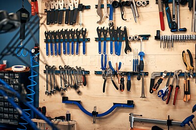 Buy stock photo Wall, industry and tools in workshop for repairs, maintenance or manufacturing crafts. Carpentry, board and organised storage of equipment for layout with engineering project in empty garage.