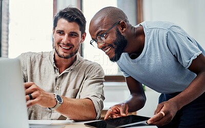 Buy stock photo Cropped shot of a handsome young businessman helping a male colleague in the office