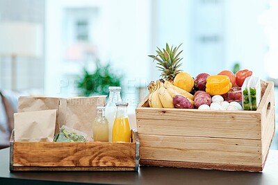 Buy stock photo Box, fresh and grocery with fruit on kitchen table for supermarket delivery, organic food and nutritionist choice. Container, healthy products and ecommerce order, diet ingredients and stock at house