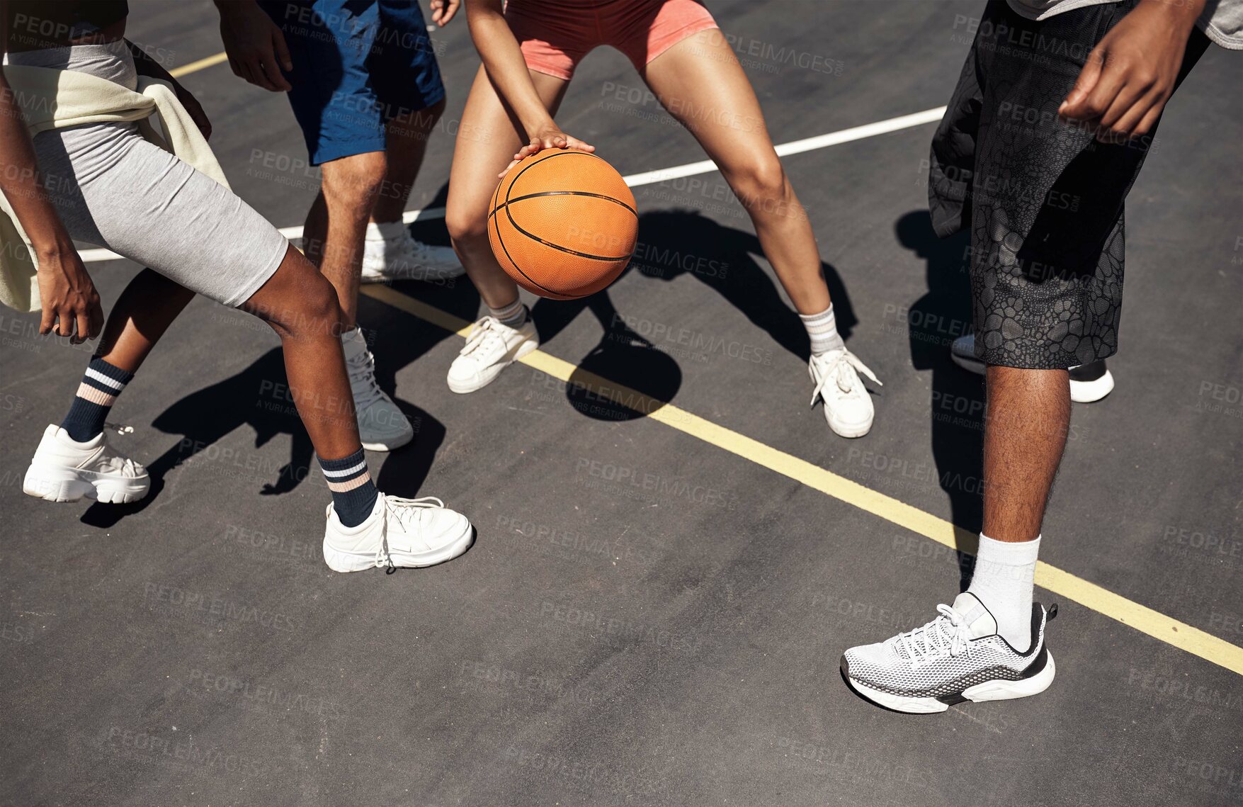 Buy stock photo Friends, basketball and legs for playing on court, community and outdoor competition with people. Sports, games and match for fitness at recreation centre, bounce and friendly tournament practice