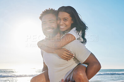 Buy stock photo Piggy back, beach and portrait of couple for bonding, affection and happy relationship by ocean. Dating, travel and man and woman with smile for romance on holiday, vacation and weekend in nature