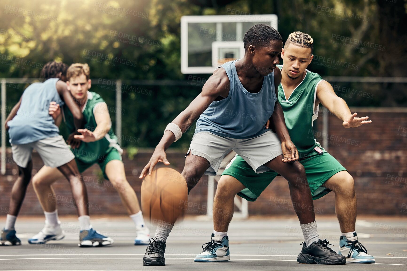 Buy stock photo Sports, team and men playing basketball in a competition for college or university players with talent, skill and fitness. People in a competitive training match on an outdoor court using teamwork