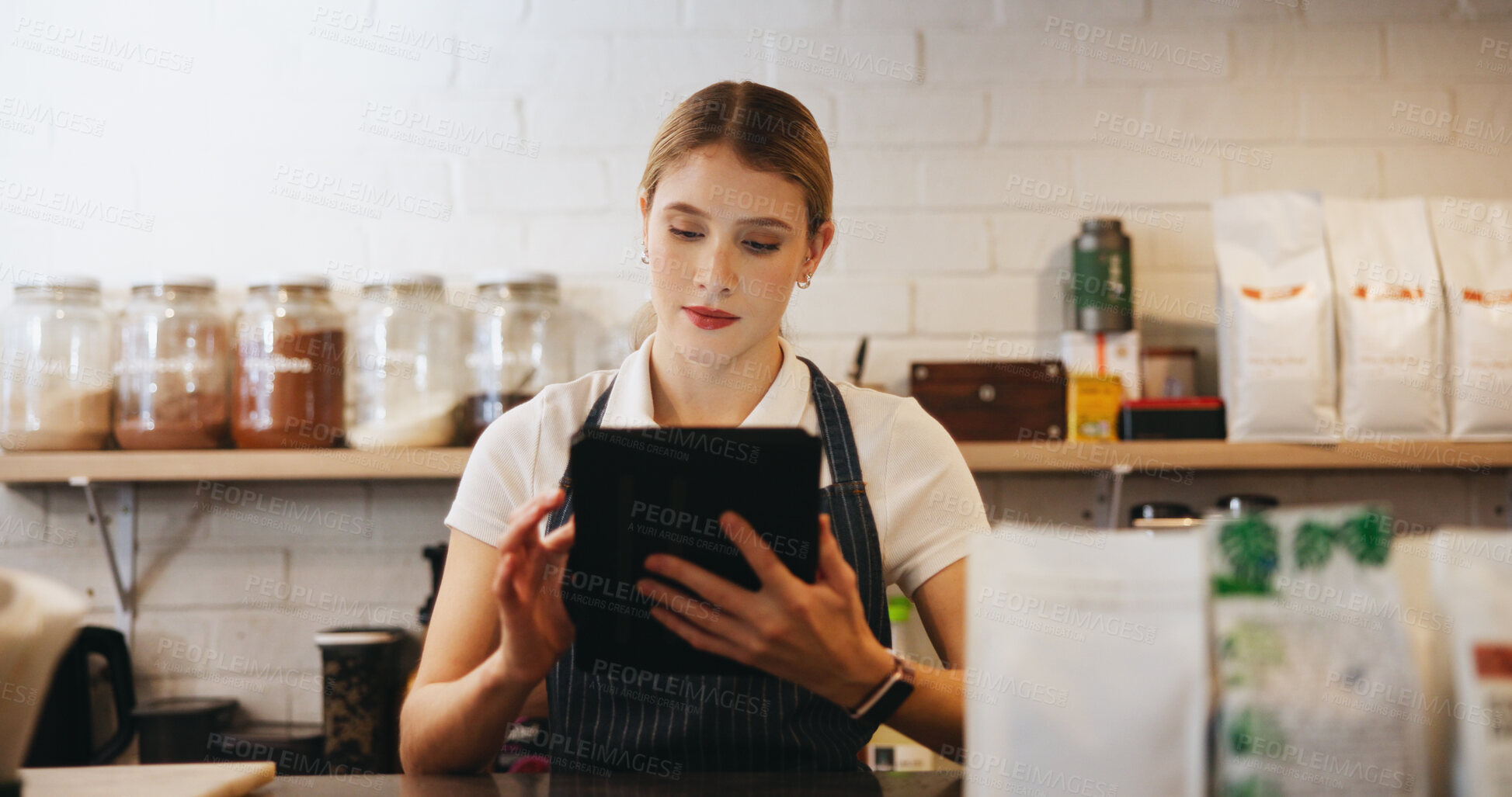 Buy stock photo Tablet, woman and waitress in coffee shop for online menu for order on app for hospitality service. Inventory, reading and female barista with digital technology for stock list in cafe or restaurant.
