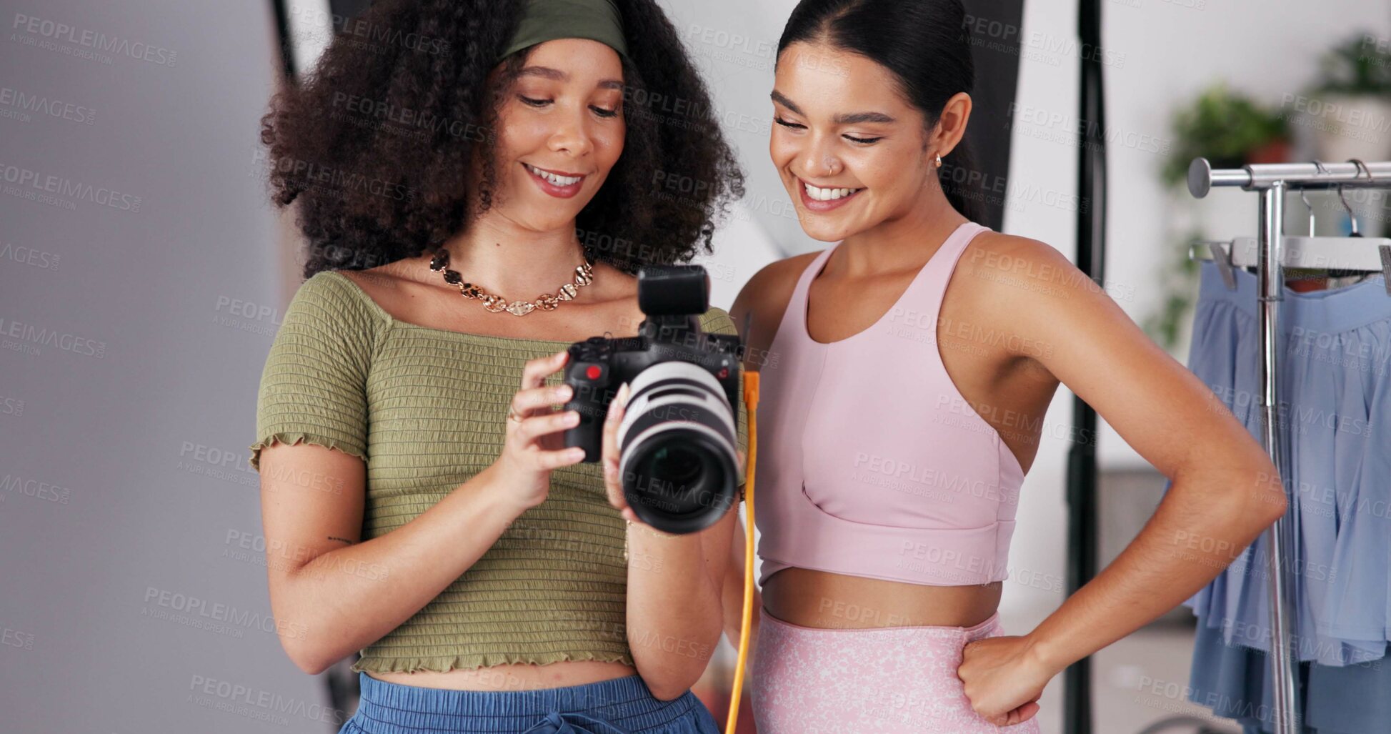 Buy stock photo People, camera and direction with photoshoot in studio, collaboration and instructions for shooting. Women, photographer and speaking to model for filming feedback, review image and backstage project