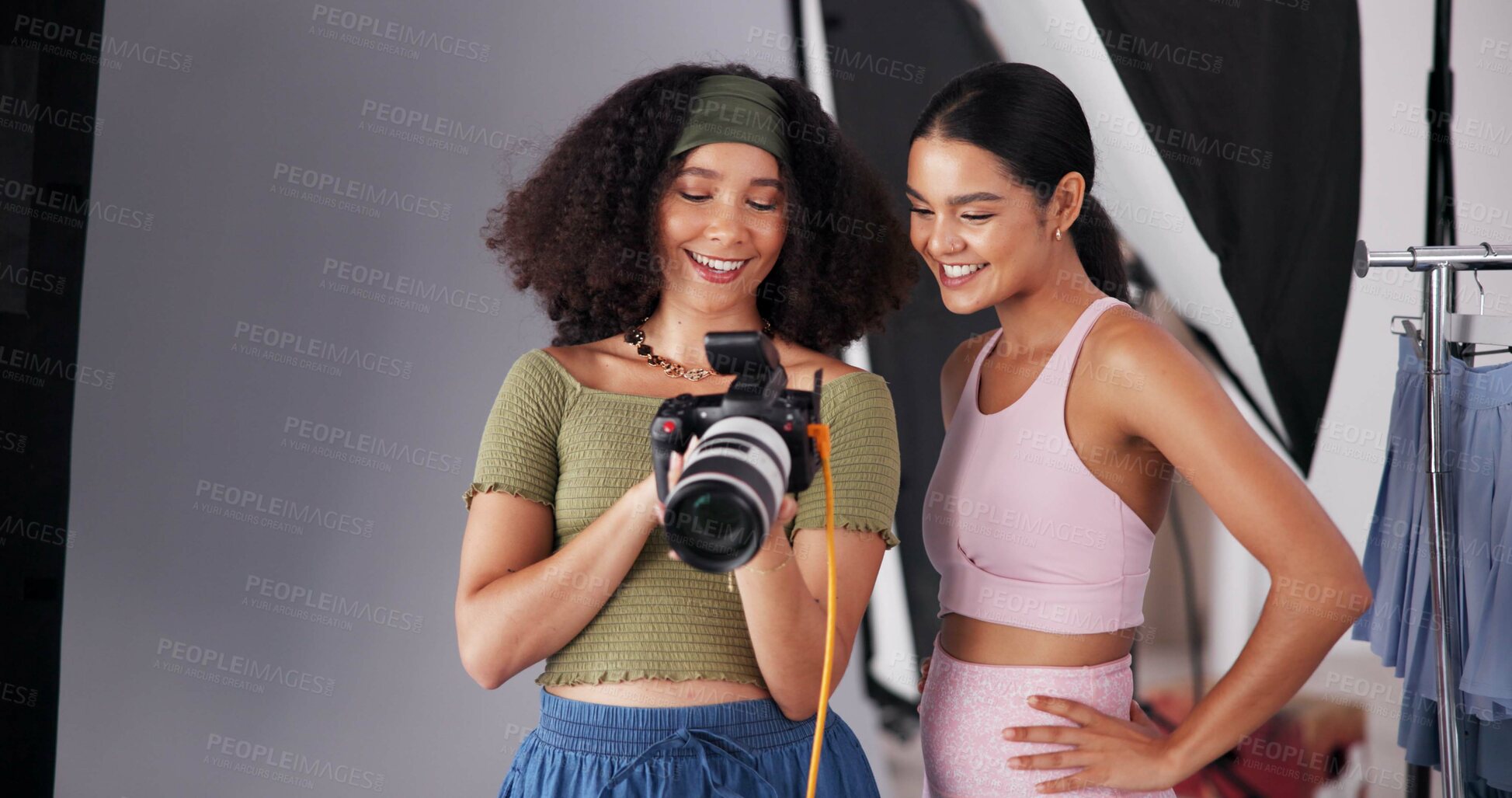 Buy stock photo People, camera and direction with photoshoot on set, collaboration and instructions for shooting. Women, photographer and speaking to model for filming feedback, review image and backstage project